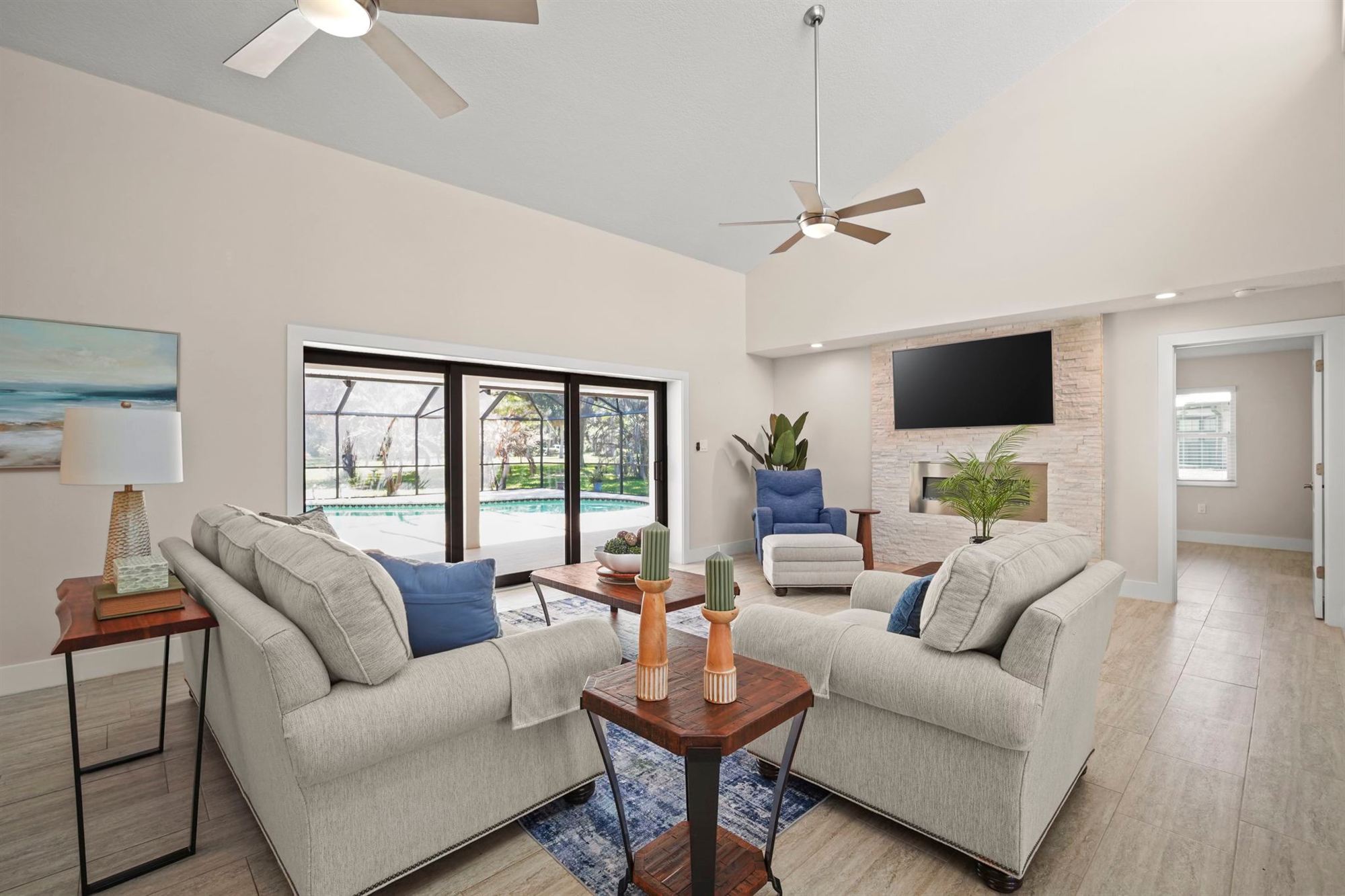 Bright Brevard County living room opening onto a screened pool